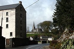 Former mill buildings and Saint Mary's Church of Ireland church at Castletownroche