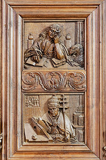 John the Evangelist sits working, his attribute the eagle at his side. In the lower panel is Saint Gregory the Great