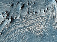 Close view of layers in Candor. Image has been processed in color to bring out more detail. It was named HiRISE picture of the day for November 9, 2023.