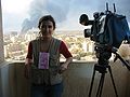 Journalist Olga Rodriguez on the balcony of a room at the Palestine Hotel, 2003
