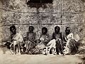 Famine in Mysore, India; six emaciated women, five sitting a Wellcome
