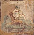 Sex between a female and a male.The figure on the left has a garland of rose petals around their head. The figure to the right is wearing a strophium which is a kind of bra or bikini top.[23] Pompeii. Around 70CE
