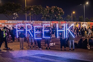 Protesters holding a 'FREE HK' sign