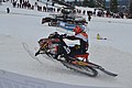 Snowmobile performing a wheelie