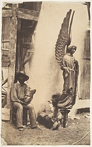 The sculptor Adolphe-Victor Geoffroy-Dechaume with his archangel of the Passion and the head of another sculpture (1847)