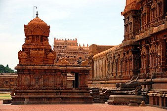 Chandeshvara shrine. On right is the wall of main temple, in back the eastern gopuram. Chandeshvara is a meditating yogi and Nayanmar Bhakti movement saint.