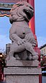 One of the stone lions that guards the gate of Chinatown in Victoria, British Columbia