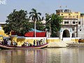 Devotees reach the Sadh Belo temple, which is situated in the middle of the Indus River.