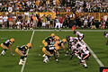 The Bears defense take on Packers quarterback Brett Favre