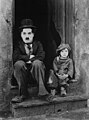 Image 23Charlie Chaplin in his 1921 film The Kid, with Jackie Coogan. (from 20th century)