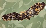 Chocolate-covered bacon with crushed cashews