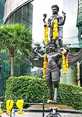 A statue in Bangkok depicting Vishnu on his vahana Garuda, the eagle. One of the oldest discovered Hindu-style statues of Vishnu in Thailand is from Wat Sala Tung in Surat Thani Province and has been dated to ~400 CE.[158]