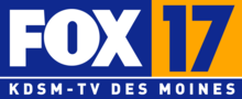 From top left: A blue box with the Fox network logo in white. Next to it is a gold square containing a numeral 17 in a sans serif. Below is another blue box with the words "K D S M-TV Des Moines", widely tracked, also in a sans serif, in white.
