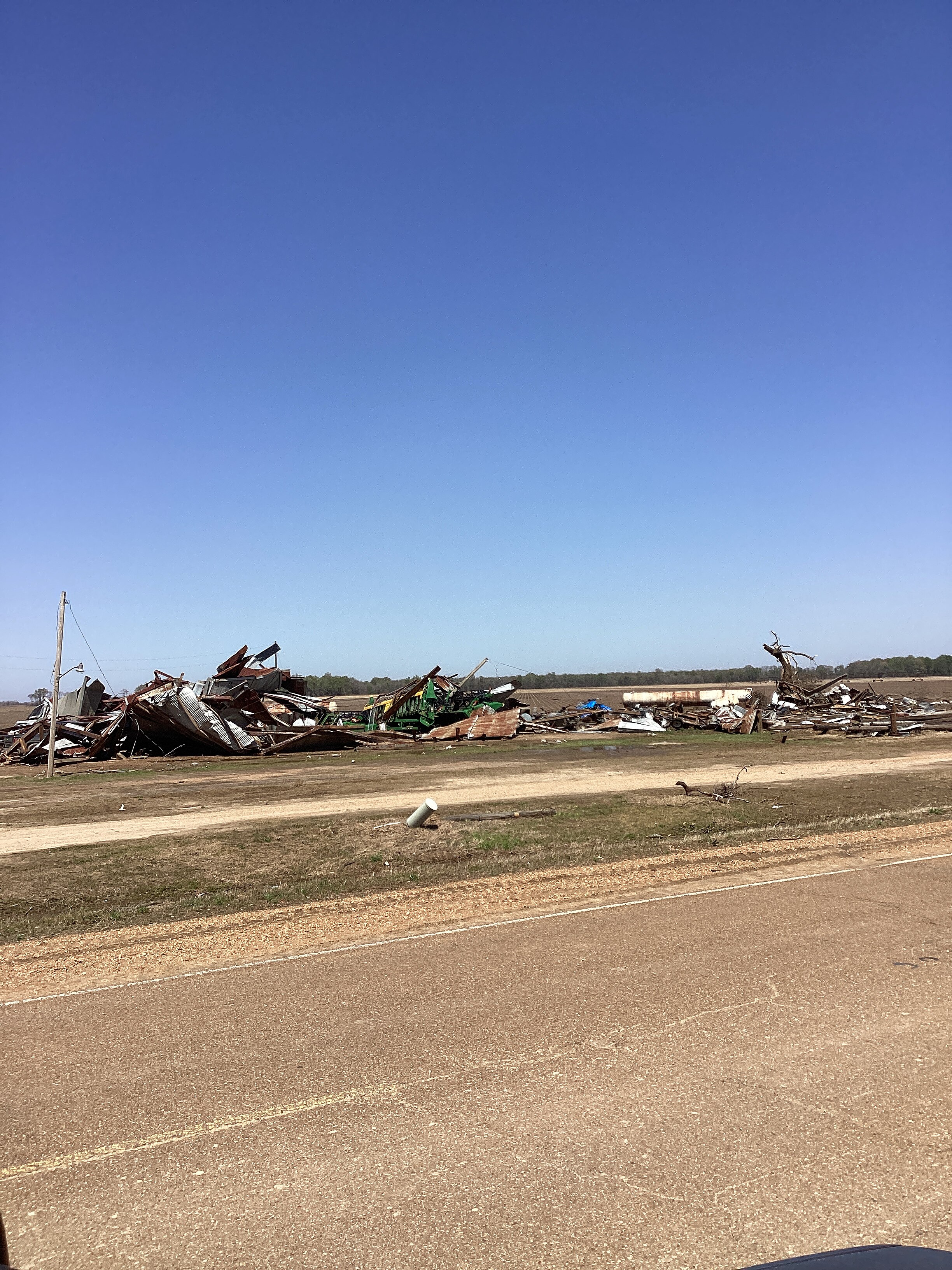 A metal building that was leveled at low-end EF3 intensity northeast of Midnight, Mississippi.