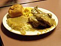 Image 13 Smothered chicken, mashed potatoes and gravy, macaroni and cheese and roll (from Culture of Arkansas)
