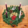 Advent wreath with three purple candles and one rose candle