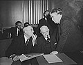 Image 16John L. Lewis (right, President of the United Mine Workers, confers with Thomas Kennedy (left), UMW Secretary-Treasurer of the UMW, and a UMW official at the War Labor Board in 1943 about a coal miners' strike.