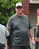 Mike Tice wearing a T-shirt, cap and sunglasses