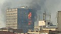 Plasco Building on fire prior to collapse in 2017.