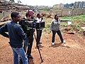 Image 15Filmmaker Nathan Collett (with camera) shooting feature film Togetherness Supreme in collaboration with Kibera youth trainees. (from Culture of Kenya)