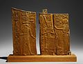 Arm panel from a ceremonial chair of Thutmose IV depicting the king seated with Thoth and a lioness-headed goddess, now in the Metropolitan Museum of Art