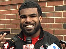 Ezekiel Elliott picture while being questioned by reporters in 2015 when he played for Ohio State