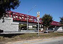 The MetroPath footbridge marks the entrance to SR 878 at its eastern terminus at US 1, near South Miami