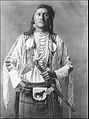 A nineteenth century photograph of a Plains Indian showing a belted bag known as a medicine pouch.
