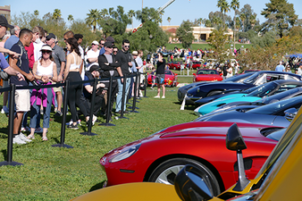 Spectators look at sports cars at Concours in the Hills.
