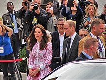 Catherine and William waking past a group of photographers