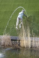 Tourism statue in Madurodam, Netherlands, of the nameless boy plugging a dike