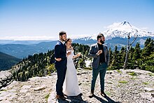 Bride and Groom with wedding officiant during elopement ceremony near Mt. Hood, Oregon
