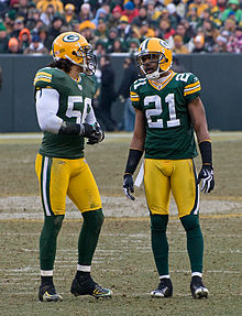 Barnett and Woodson standing next to each in uniform during a game