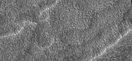 Close up of scalloped ground, as seen by HiRISE under HiWish program. Surface is divided into polygons; these forms are common where ground freezes and thaws. Note: this is an enlargement of a previous image.