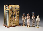 Yellow double vaulted box with four painted mummiform figures standing in front
