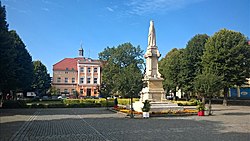 Plac Wolności (Freedom Square) with the monument of Mieszko I in the foreground and town hall in the background