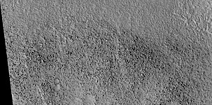 Boulders that were picked up, carried, and dropped by tsunamis, as seen by HiRISE. The boulders are between the size of cars and houses.