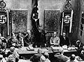 Image 2Adolf Hitler (standing) delivers a speech in February 1925. (from 1920s)