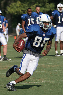Marvin Harrison running with the football during practice