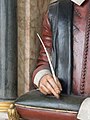 Close-up of hand and quill