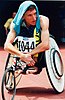 Australian T50 wheelchair athlete Fabian Blattman shades himself with a towel while he waits for his event at the 1996 Atlanta Paralympic Games