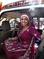 Sikh bride wearing purple lehenga and dastaar for Anand Karaj