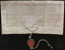 Photograph of Christina's act of abdication. Written on parchment with a red seal hanging from its bottom.
