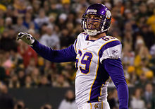Jared Allen in a Minnesota Vikings jersey and helmet