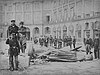 Communards pose with the toppled statue of Napoleon at the Place Vendôme following the destruction of the Colonne Vendôme on May 8, 1871
