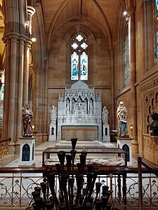Chapel of the Irish Saints with reredos depicting the Crucifixion, flanked by statues of St Patrick and Brigid of Ireland.