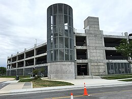 A gray concrete 4-story parking deck