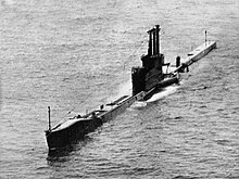 The Royal Navy Amphion-class submarine operating on the surface in the South China Sea during exercise "Oceanlink" in May 1958.