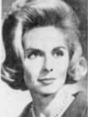 A blonde white woman with hair in a bouffant set.