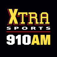 On a black background, the letters "XTRA" with a bold X and thinner TRA in a block typeface in yellow with red shadow, and beneath them, the word "SPORTS" in white, a red line, and the words "910 AM" in white and yellow
